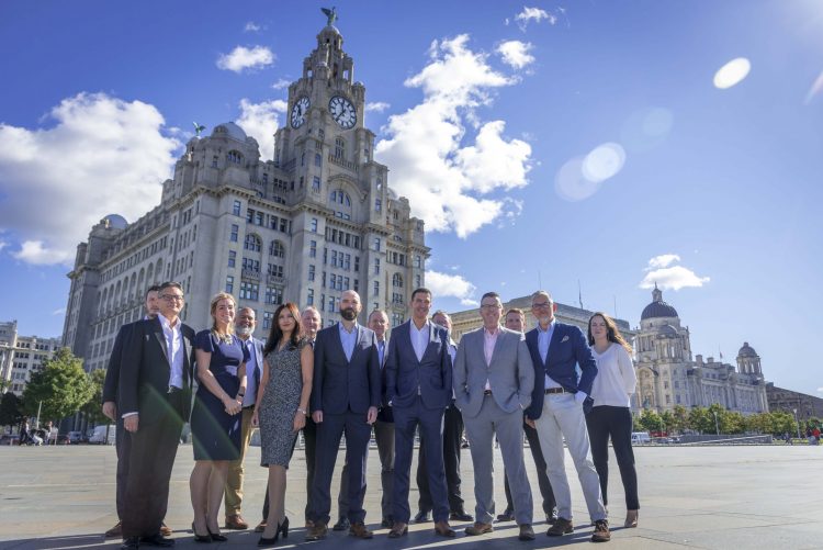 Primas Law partners outside the Royal Liver Building in Liverpool. Picture by Hannah Jones